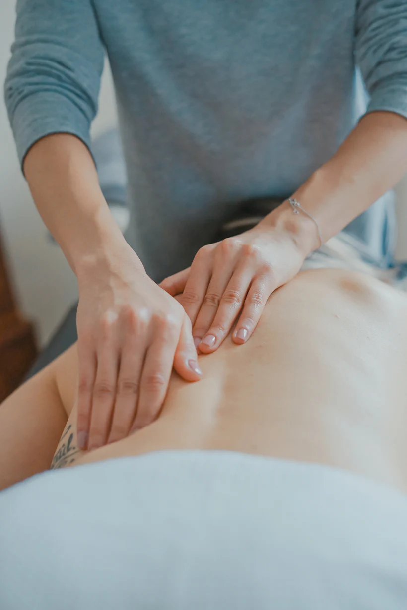 Premium body massage therapy bed with towels and oils