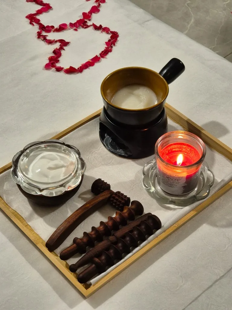 Massage oils, candles, and wellness essentials prepared for a relaxing spa experience at Zoyo Luxury Spa.